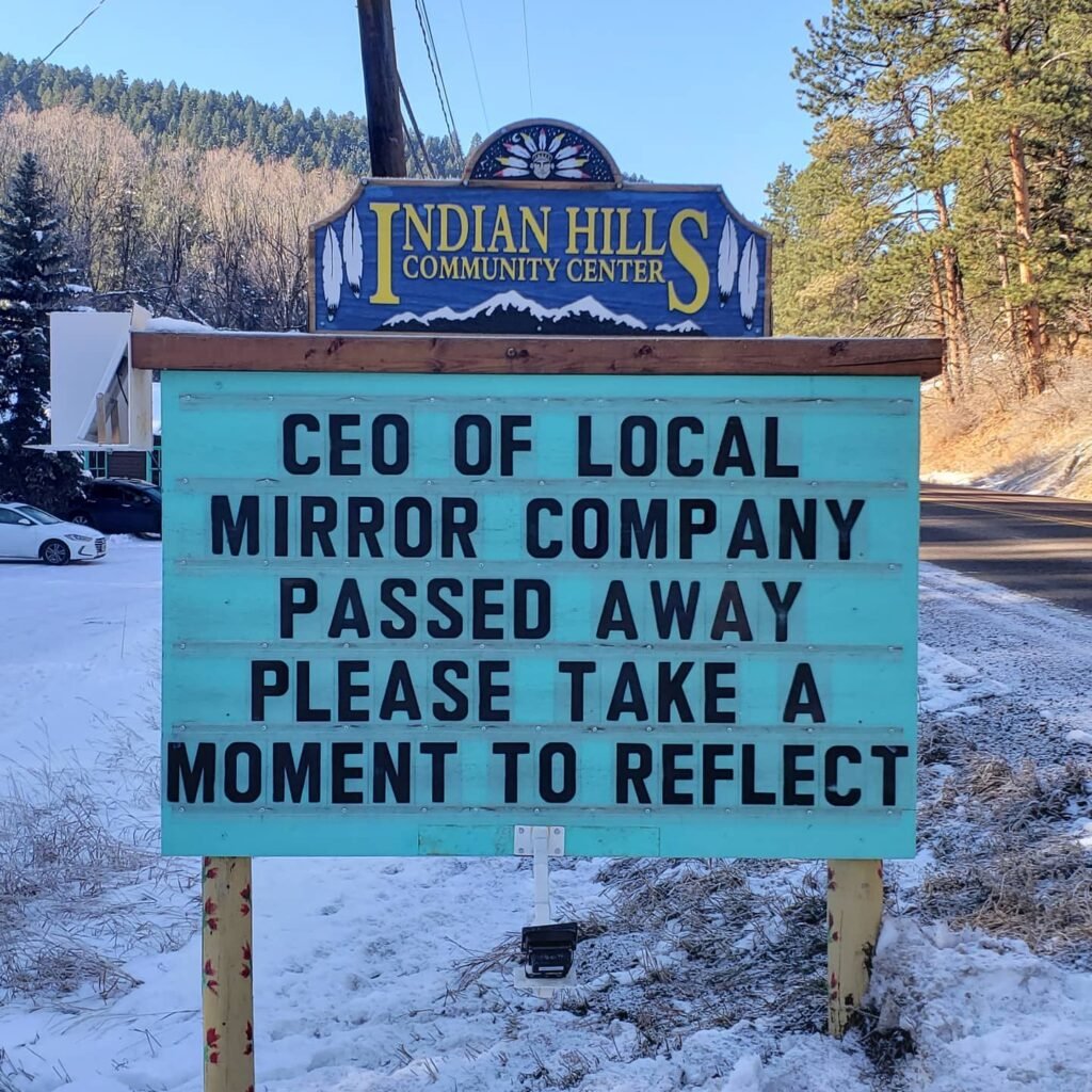 Funny Indian Hills Community Center Road Sign Joke: CEO of local mirror company passed away. Please take a moment to reflect.