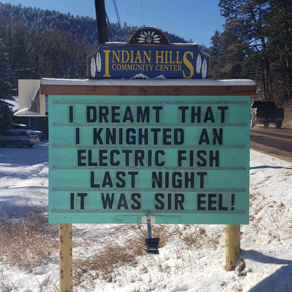 Funny Indian Hills Community Center Road Sign Joke: I dreamt that I knighted an electric fish last night. It was sir eel!