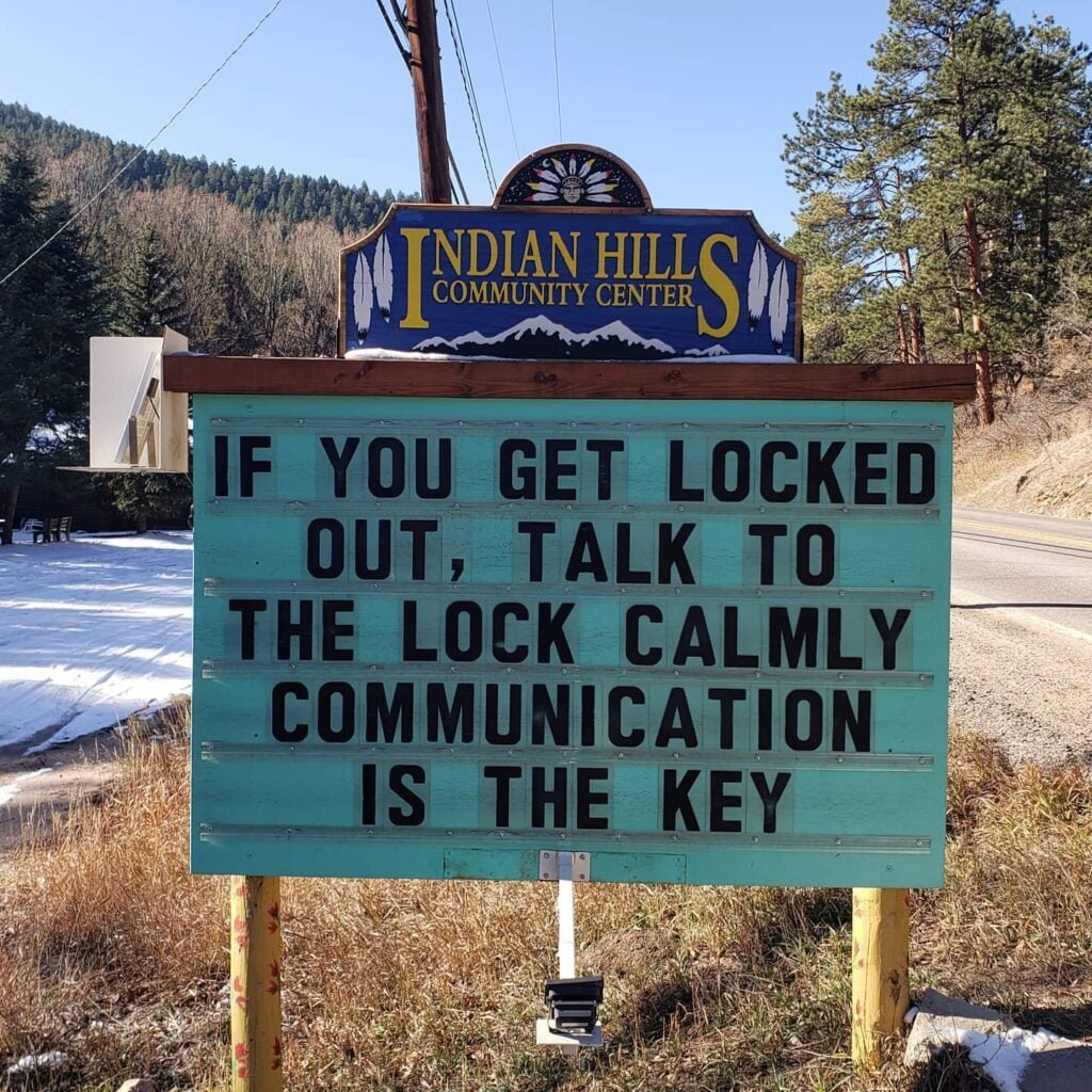 Funny Indian Hills Community Center Road Sign Joke: If you get locked out, talk to the lock calmly. Communication is the key.
