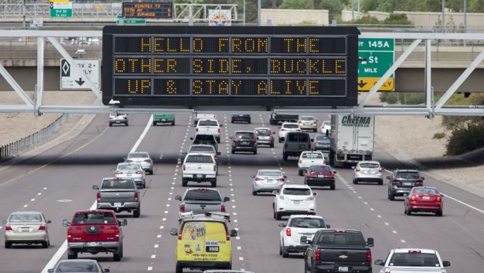 Funny Highway Road Signs hello from the other side buckle up and stay alive