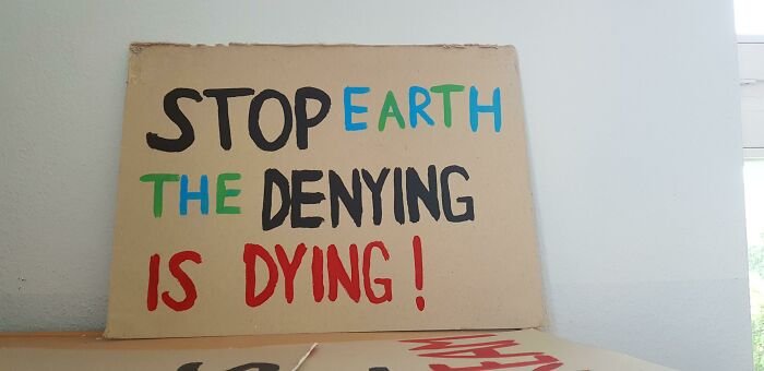Funny Confusing Sign stop earth the denying is dying