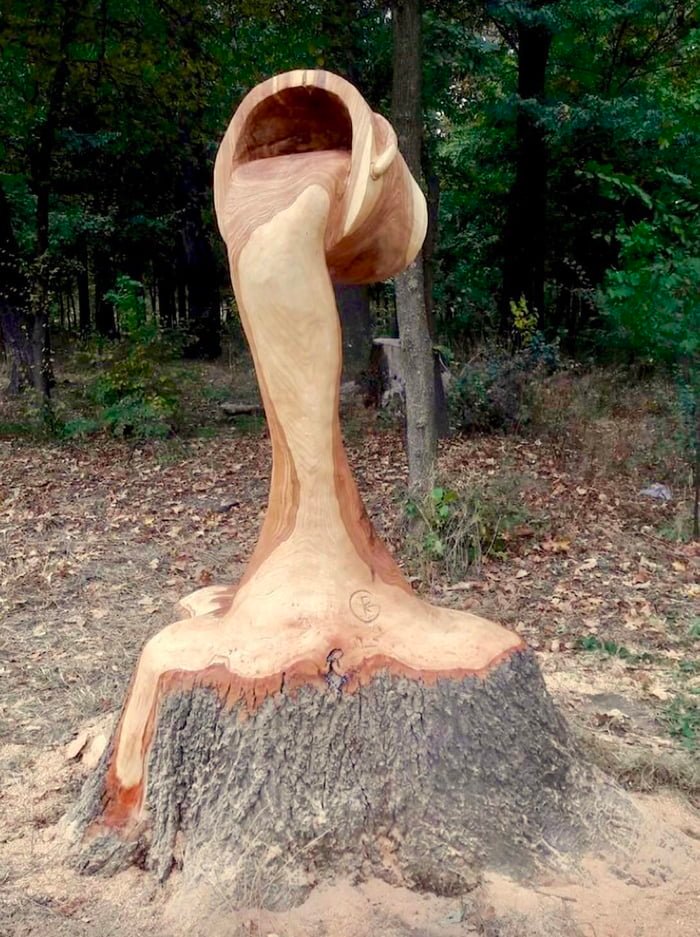 Impressive Wood Carving bucket water sculpture