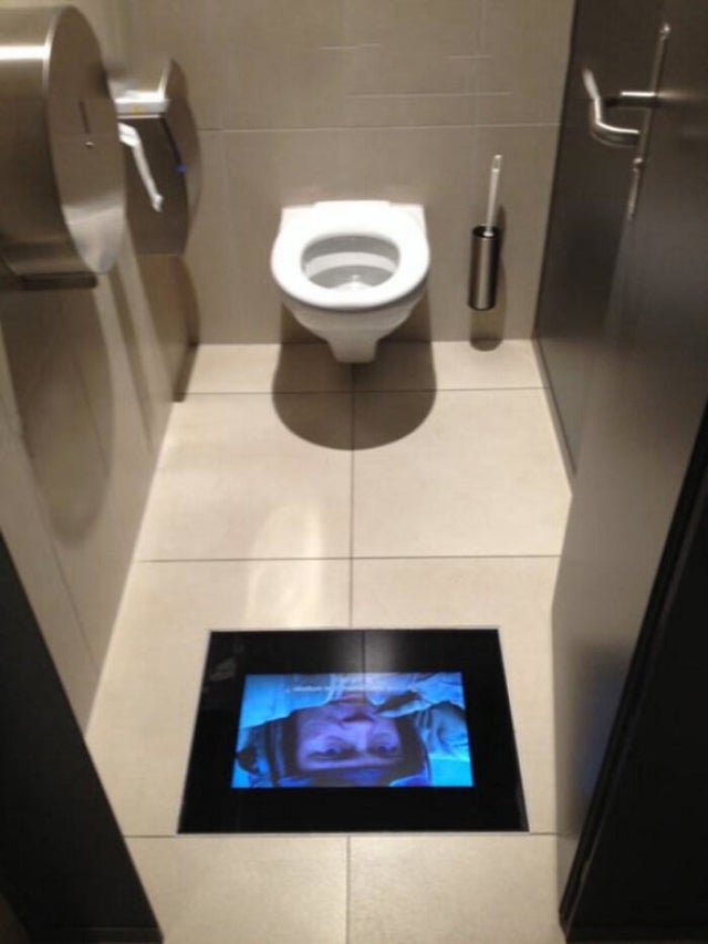 Interesting Fact movie theater in Switzerland has screens in the bathrooms