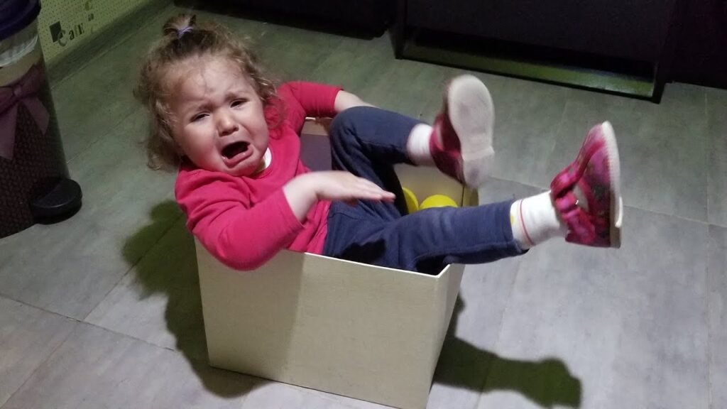 Hilarious kid gets stuck in box