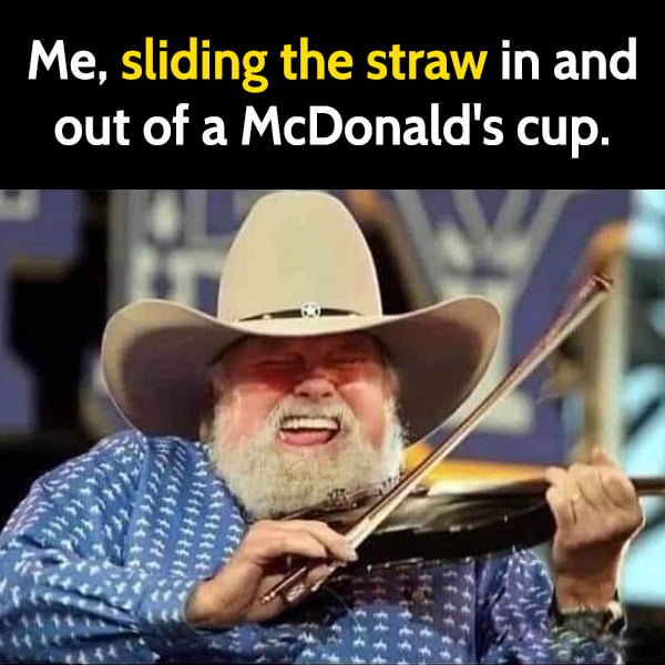 Me sliding the straw in and out of a McDonald's cup.