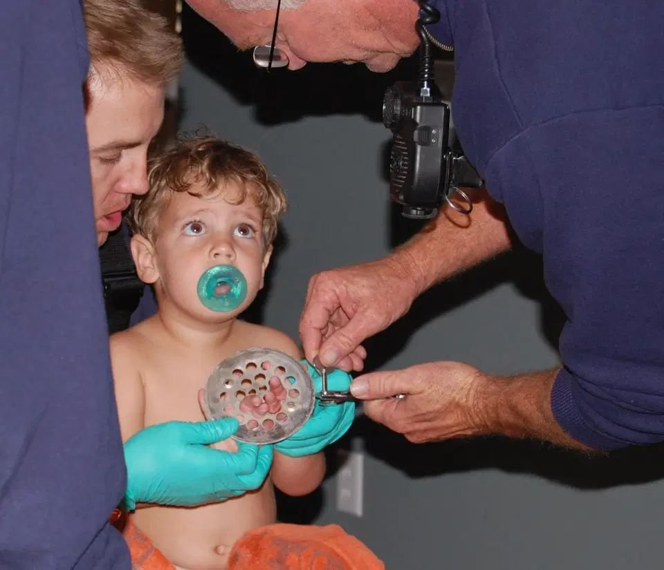 Hilarious kid gets stuck in shower drain hole