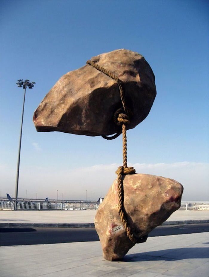 Statues Defying Gravity floating rocks