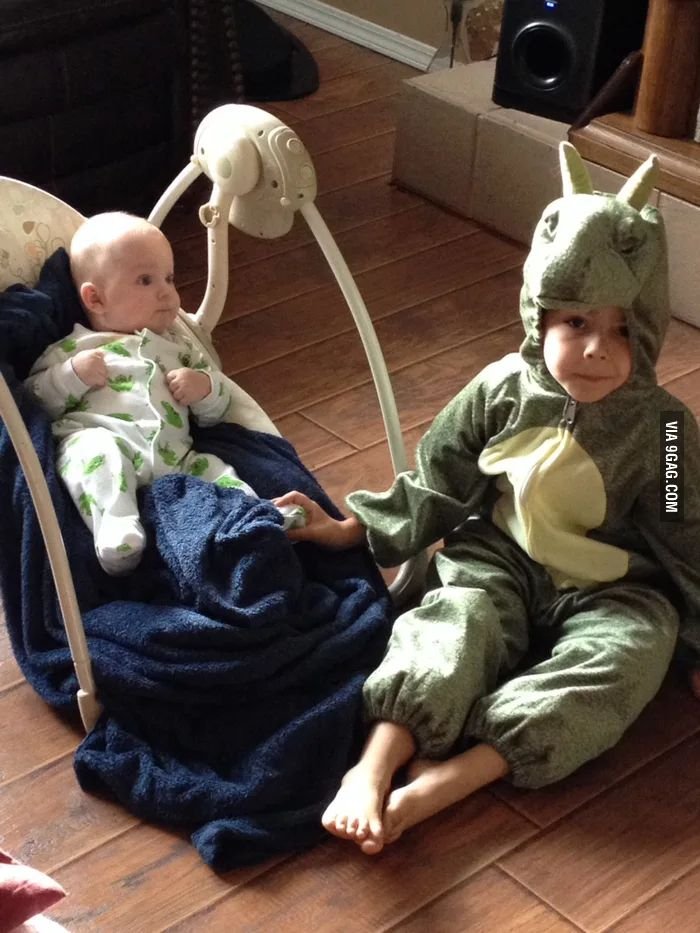 adorable innocent child dresses up in costume to stop baby from crying