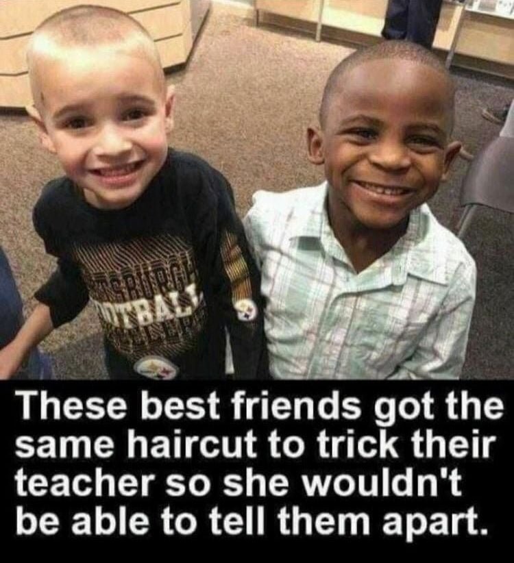 adorable innocent child white boy and black boy say they get the same haircuts so teacher can't tell them apart.