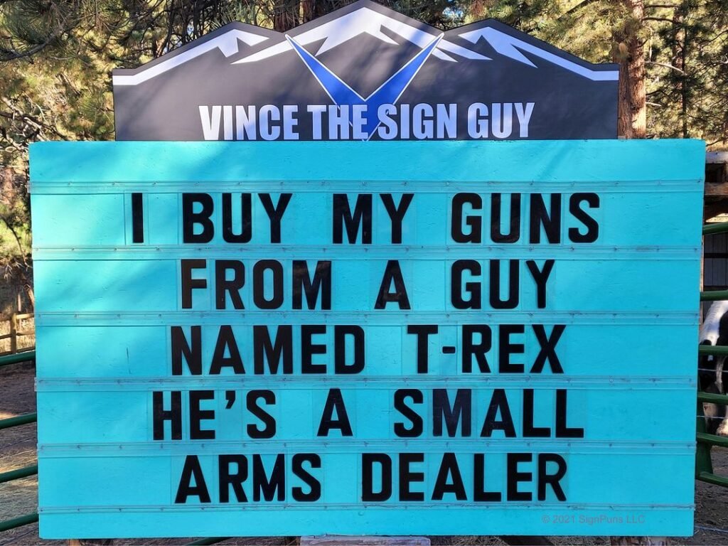 funny pun Indian Hills Community road sign I buy my guns from a guy named T-rex. He's a small arms dealer.