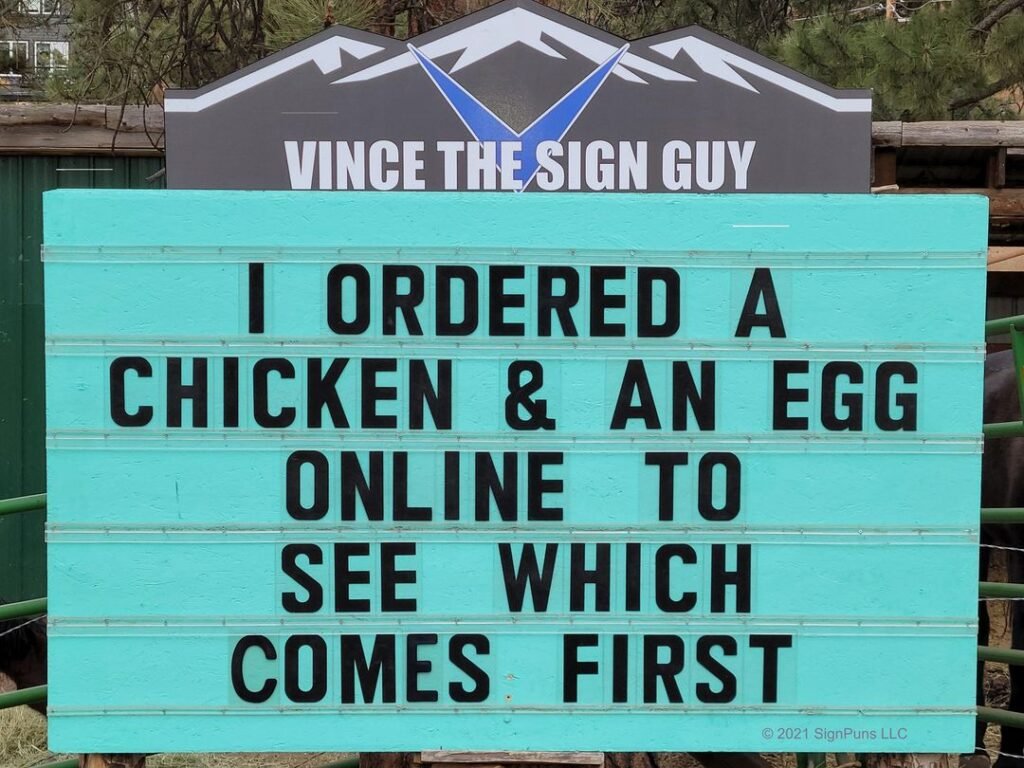funny pun Indian Hills Community road sign I ordered a chicken & an egg online to see which comes first.