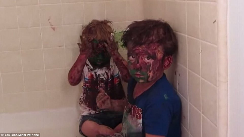 funny kids play with paint mess